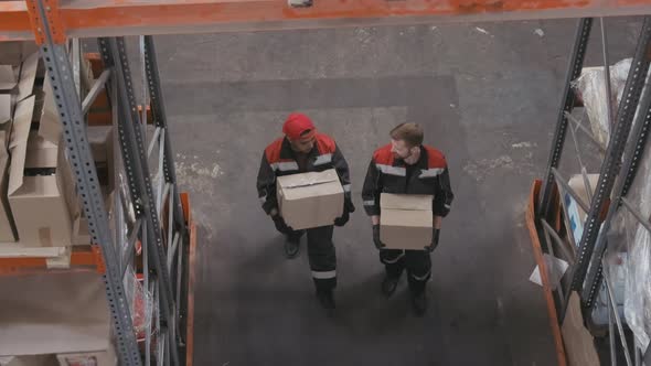 Carrying Boxes In Stockroom