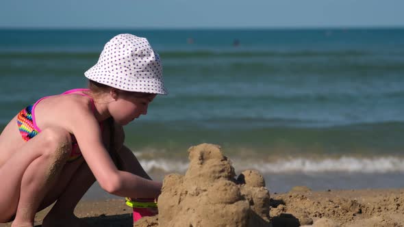 Kid Play with Sand on the Beach