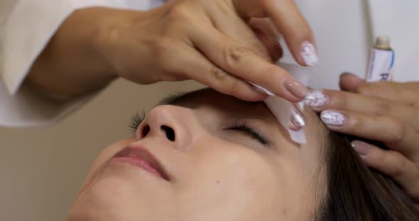 Close up of cosmetologist making microblading procedure