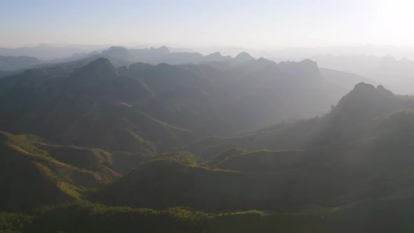 Aerial top view of forest trees and green mountain hills. Nature landscape background, Thailand.