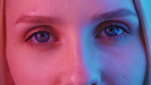 Women's Eyes in Neon Light