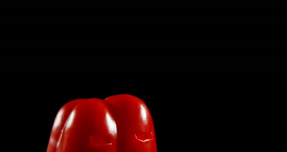 Halloween red pepper against black background 4k