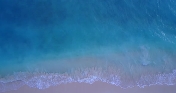 Natural birds eye copy space shot of a summer white paradise sand beach and blue sea background 