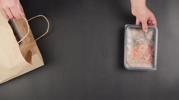 Taking Food Delivery in Disposable Containers From Paper Bag Top View Take Away Meals Catering