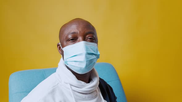 AfricanAmerican Bald Man Abruptly Removes Mask From Face and Smiles