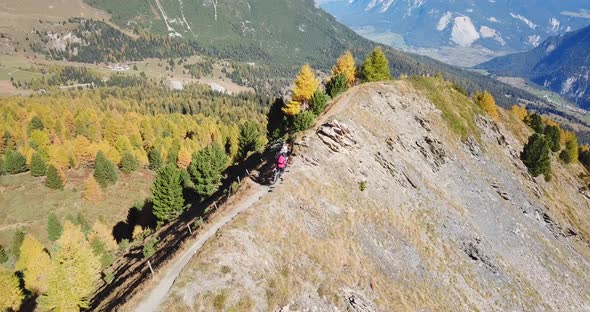 Aerial drone view of a group of mountain bikers on a singletrack trail