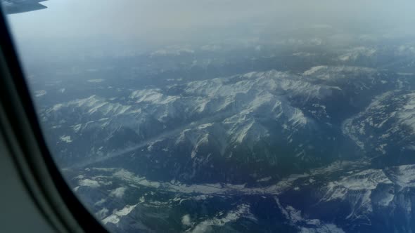 Shot from the airplane on the mountain in Austria in daytime. The Alps, Austria.
