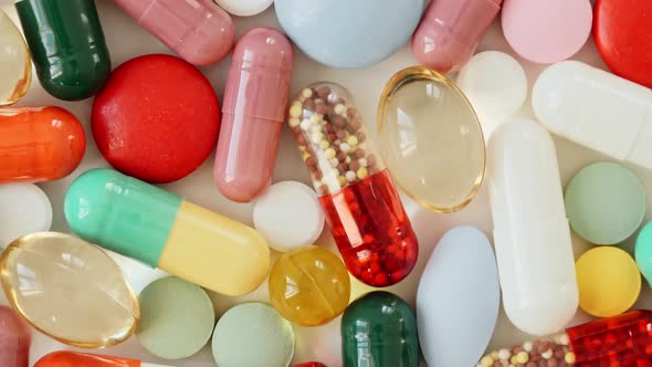 Colorful Medical Pills Oil Capsules Vitamin C Omega 3 Rotating Closeup