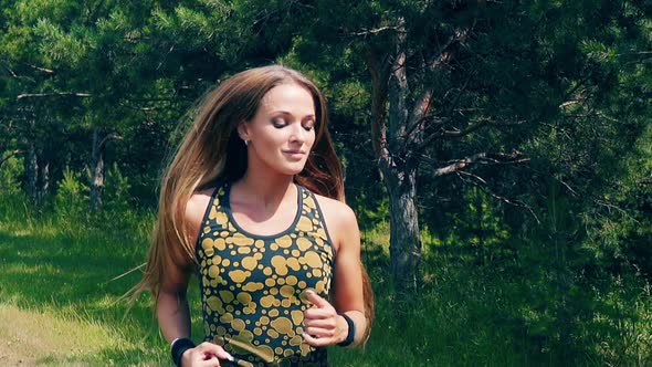 CU, Slow Motion, Portrait: Young Girl Goes in for Sports in the Morning