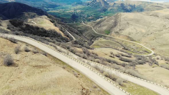 Aerial View of Serpentine Road Between Incredible Caucasus Mountains