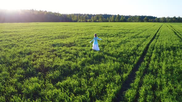 Girl Walking On Sunlight Field 6