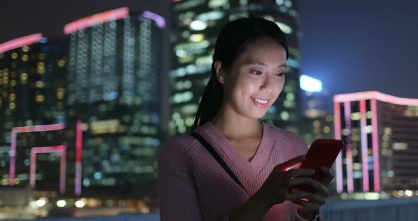 Woman use of mobile phone at night