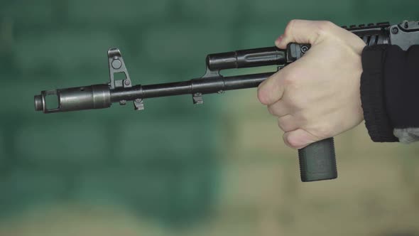 Rifle Shooter During Shooting. Close-up