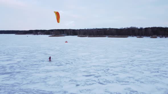 SnowKiting Kitesurfing Sport on the Ice Lake Winter