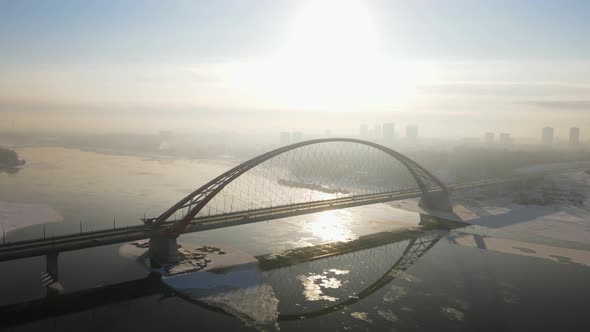 Aerial Footage of a Large Bridge Over a Winter River