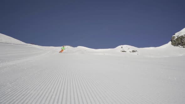 Slow Motion Sunshine Skiing With Snow Splashing on Camera