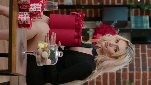 Vertical Video Portrait of Sexy Blonde Woman Holding Box with Red Roses