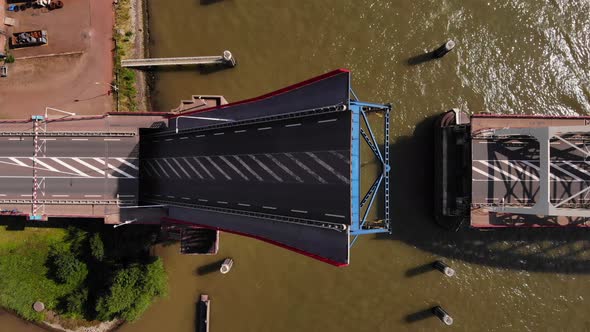 Top View Of A Single-leaf Bascule Bridge Slowly Opening Over Noord River In Alblasserdam, Netherland