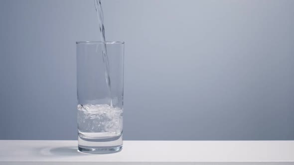 Drinking Water Pouring Into Glass on Table