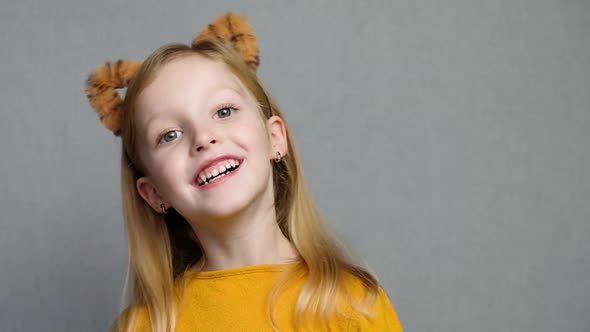 Cute Smiling Blond Girl with Tiger Ears