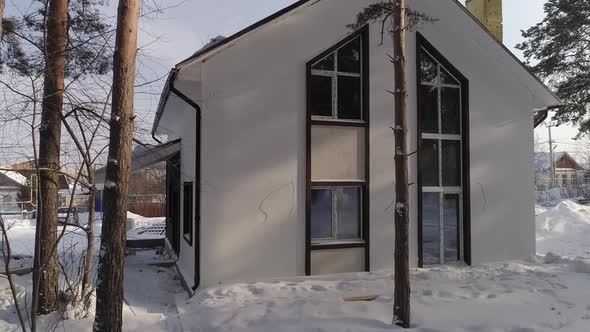 Drone shot of new white modern residential house at winter 02