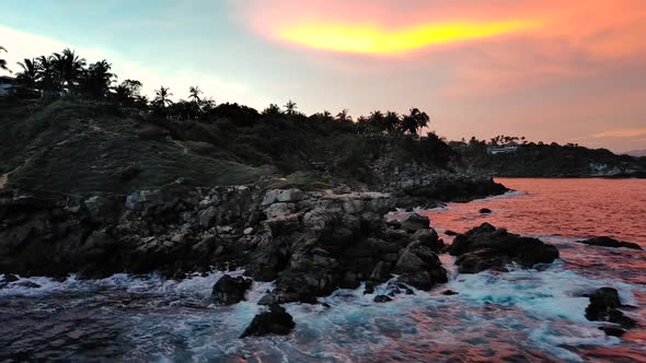 Tropical Pink Sunrise Aerial Drone Fly Over Cliff Puerto Escondido Jungle Ocean