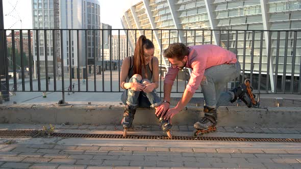 Woman and Man on Rollerblades.