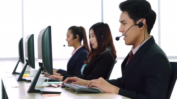 Business People Wearing Headset Working in Office