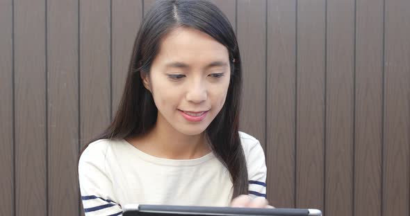 Woman working on tablet computer