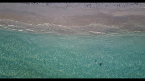 Aerial above panorama of perfect lagoon beach vacation by clear ocean with white sand background of 