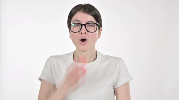 Shocked Young Woman Putting Hand on Mouth on White Background