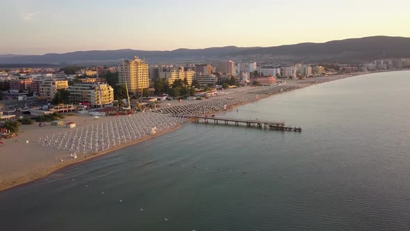 Aerial view of Sunny Beach city that is located on Black Sea shore. Top view of sand beaches