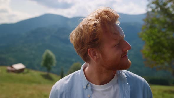 Closeup Redhair Man Enjoying Summer Holiday in Mountains