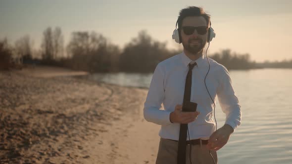 Man Listening To Music In Headphone. Businessman Relaxing Enjoying After Good News Having Fun.