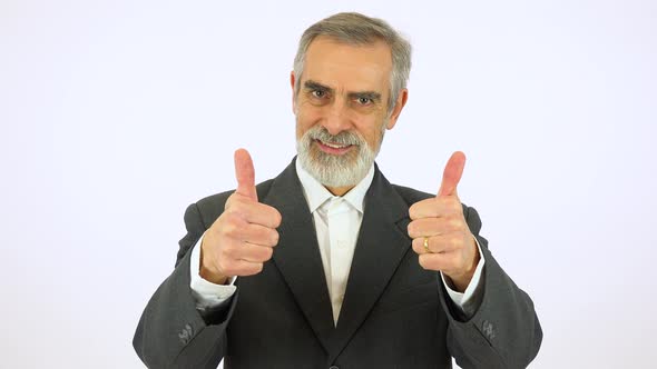 An Elderly Man Smiles and Shows a Double Thumb Up To the Camera - White Screen Studio