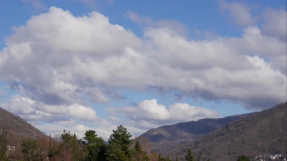 Blue Sky White Clouds Over the Mountains