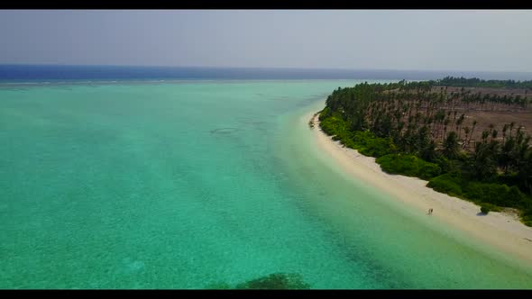 Aerial flying over nature of paradise tourist beach time by blue ocean with white sand background of