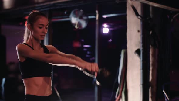 Young Sporty Woman Exercising At Gym