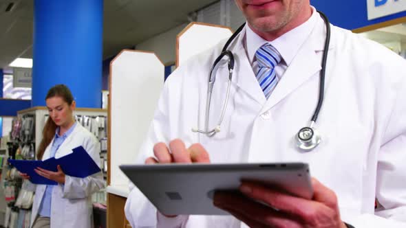 Pharmacist using digital tablet