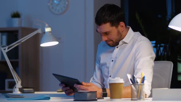 Businessman with Tablet Pc Working at Night Office 46