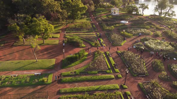 Group of tourists walking in Rosedal Park, Palermo area in Buenos Aires city, Argentina. Aerial circ