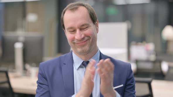 Portrait of Happy Businessman Clapping Applauding