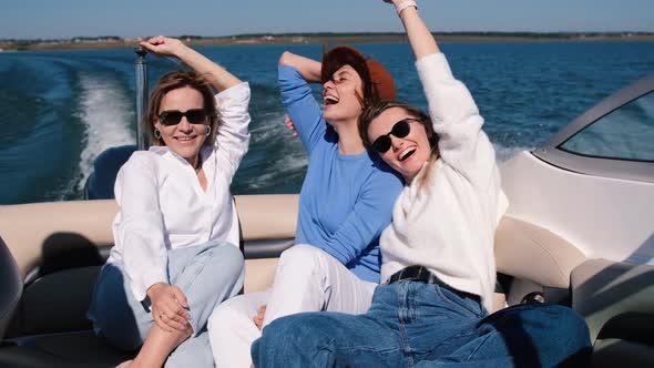 Young Women are Resting on a Speed Boat