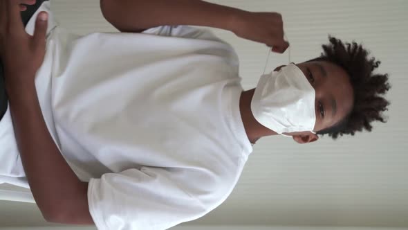 Vertical Video of African Teenager Showing COVID19 Vaccine Bandage Merrily