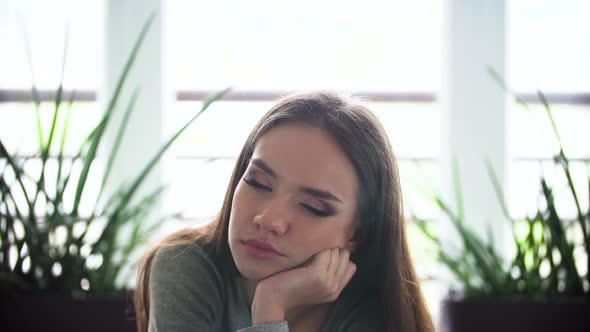 Portrait Of Sleepy Woman At Morning Indoors