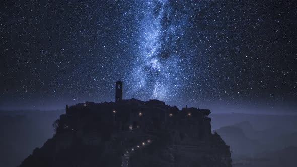 Stunning old town of Bagnoregio at night with milky way, Italy