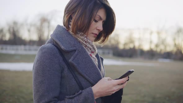 Young Beautiful Business Woman Using Smartphone Surfing the Internet