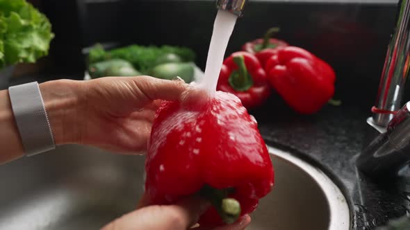 Woman Washing Red Pepper Under Tap Water Slow Motion Shot