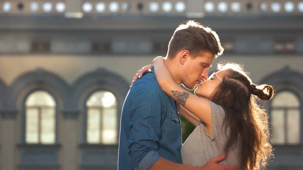 Young Romantic Couple Kissing Outdoors