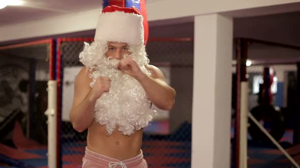 Santa Claus in Boxing Gloves Trains in the Ring